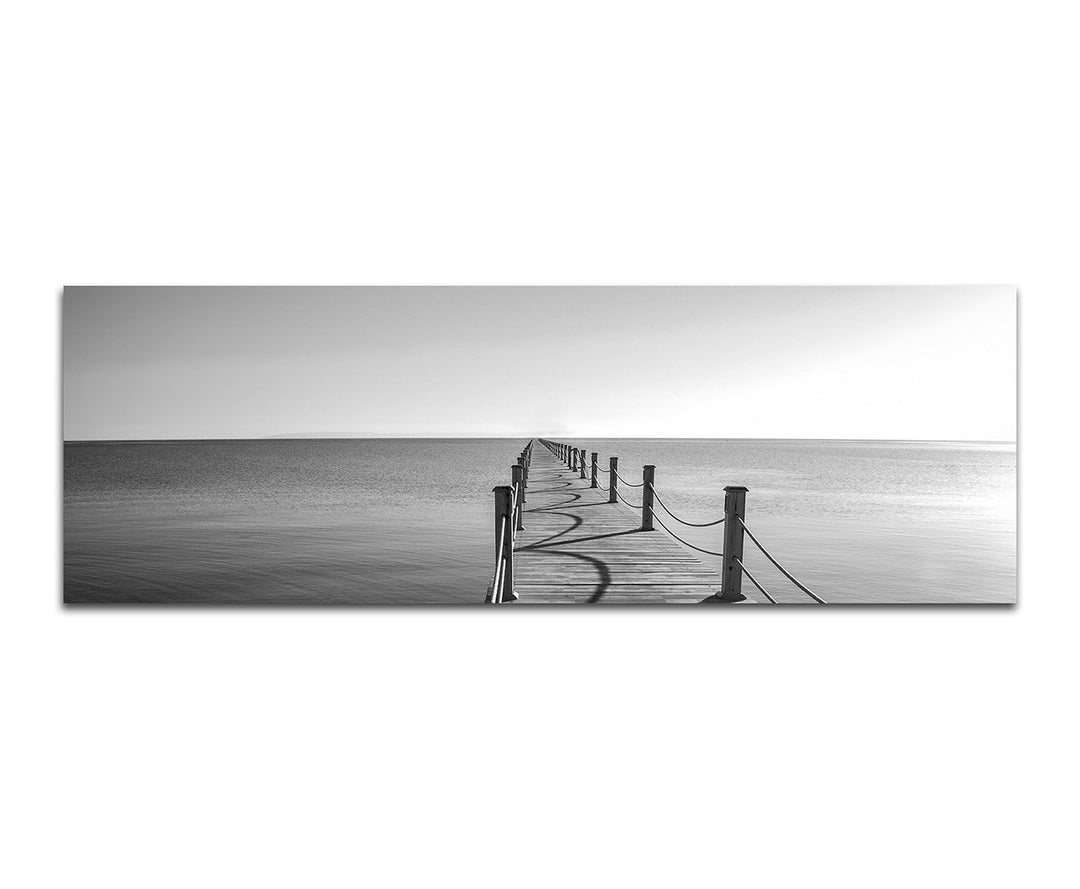 Paul Sinus Art Panoramabild auf Leinwand und Keilrahmen 150x50cm Meer Holzsteg schwarz/weiss